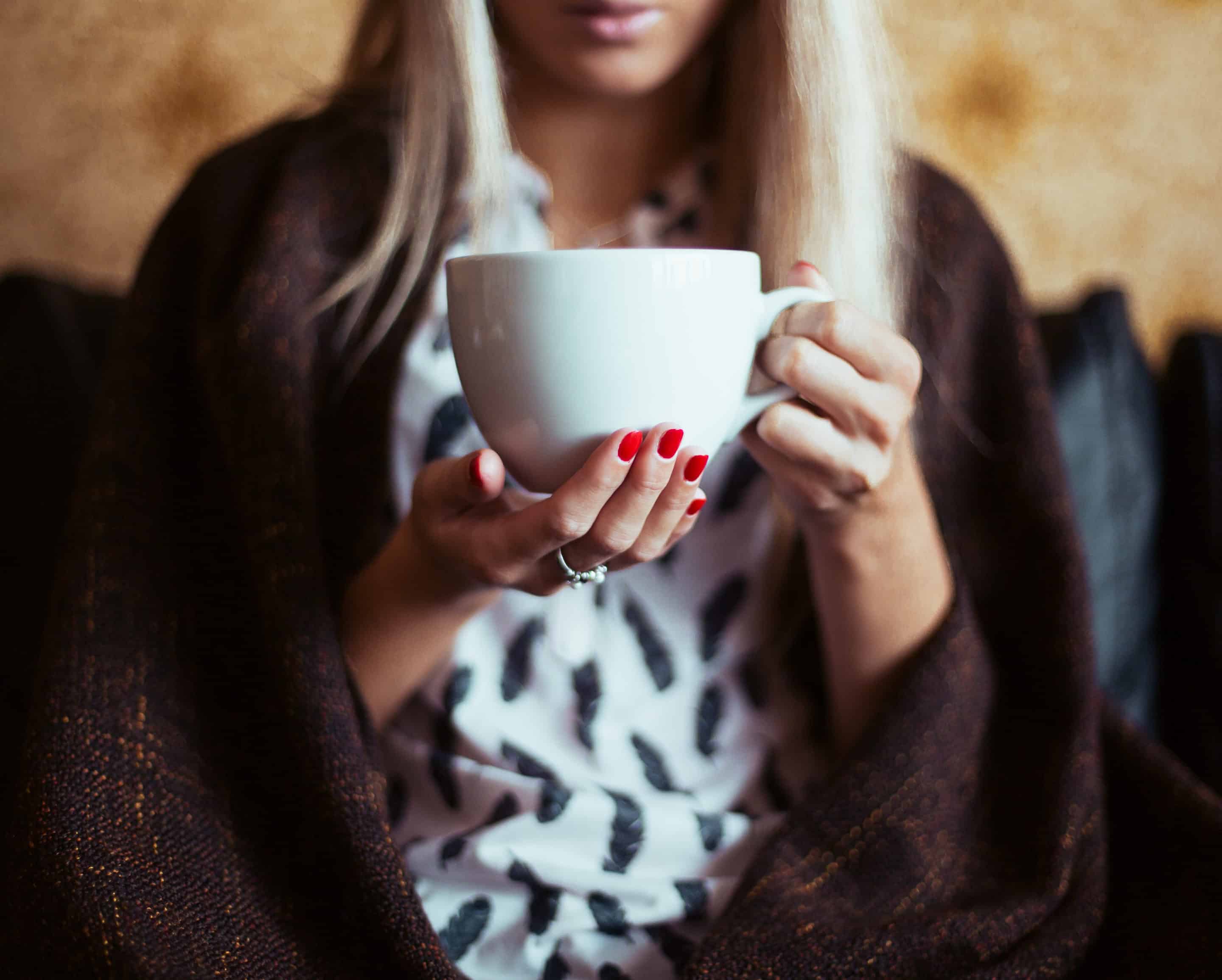 Woman holding coffee