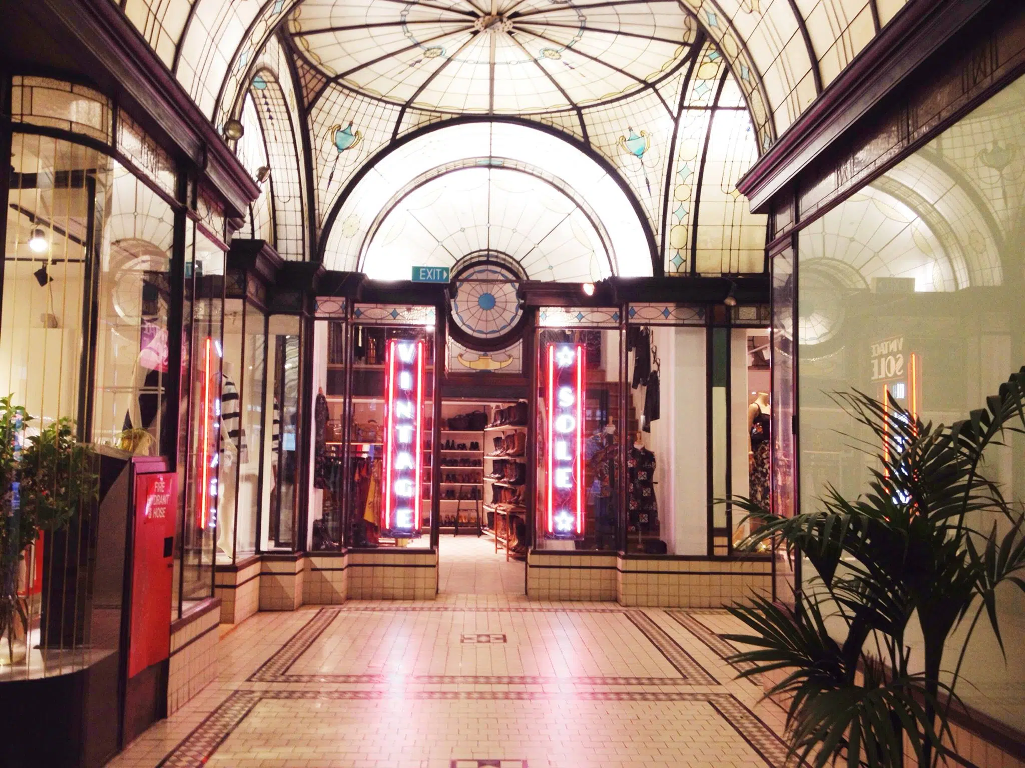 Image of a shopfront in a shopping arcade in Melbourne. The sign of the shop says Vintage Sol.
