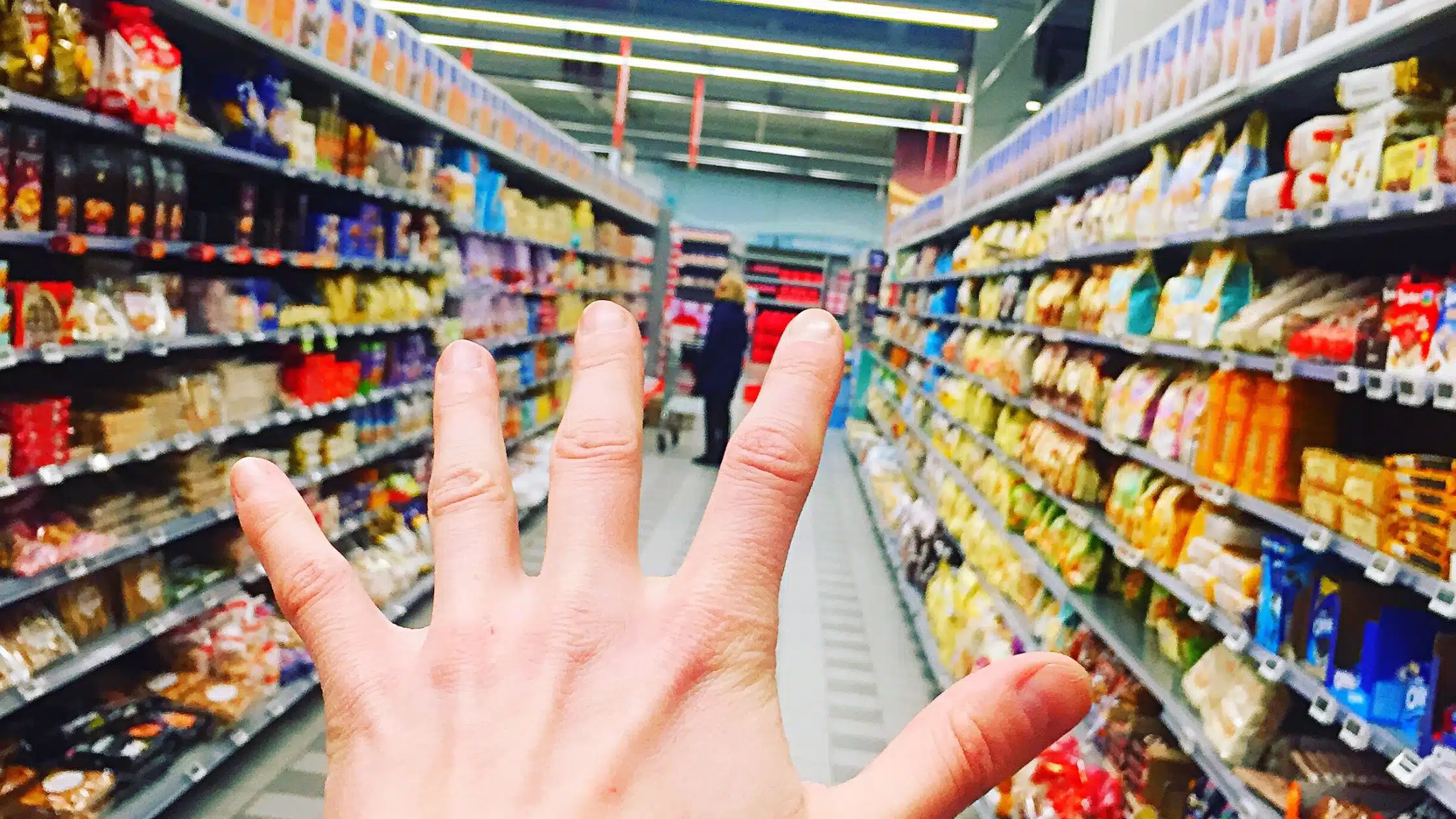 hand reaching out in the supermarket